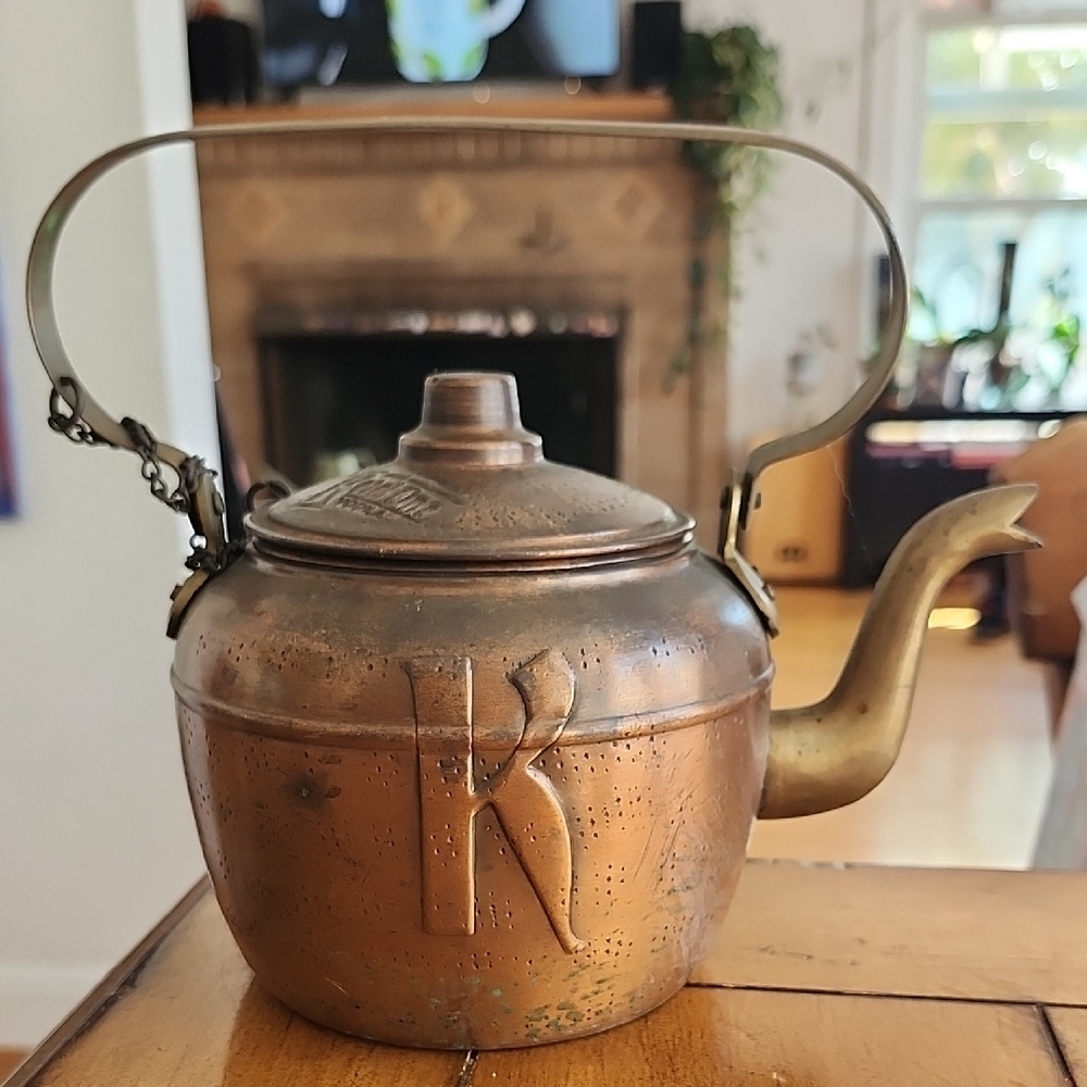 Brown Copper Teapot with Curved Spout and Arched Handle